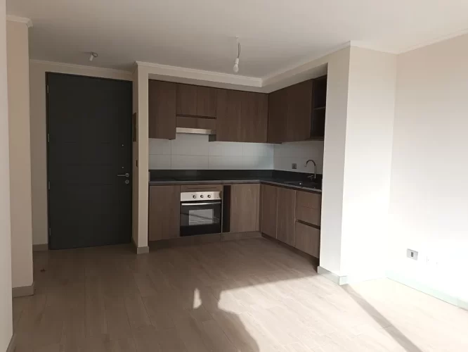 Living, comedor, cocina, entrada vista desde balcón. departamento en venta, Macul, bono pie, 3D2B